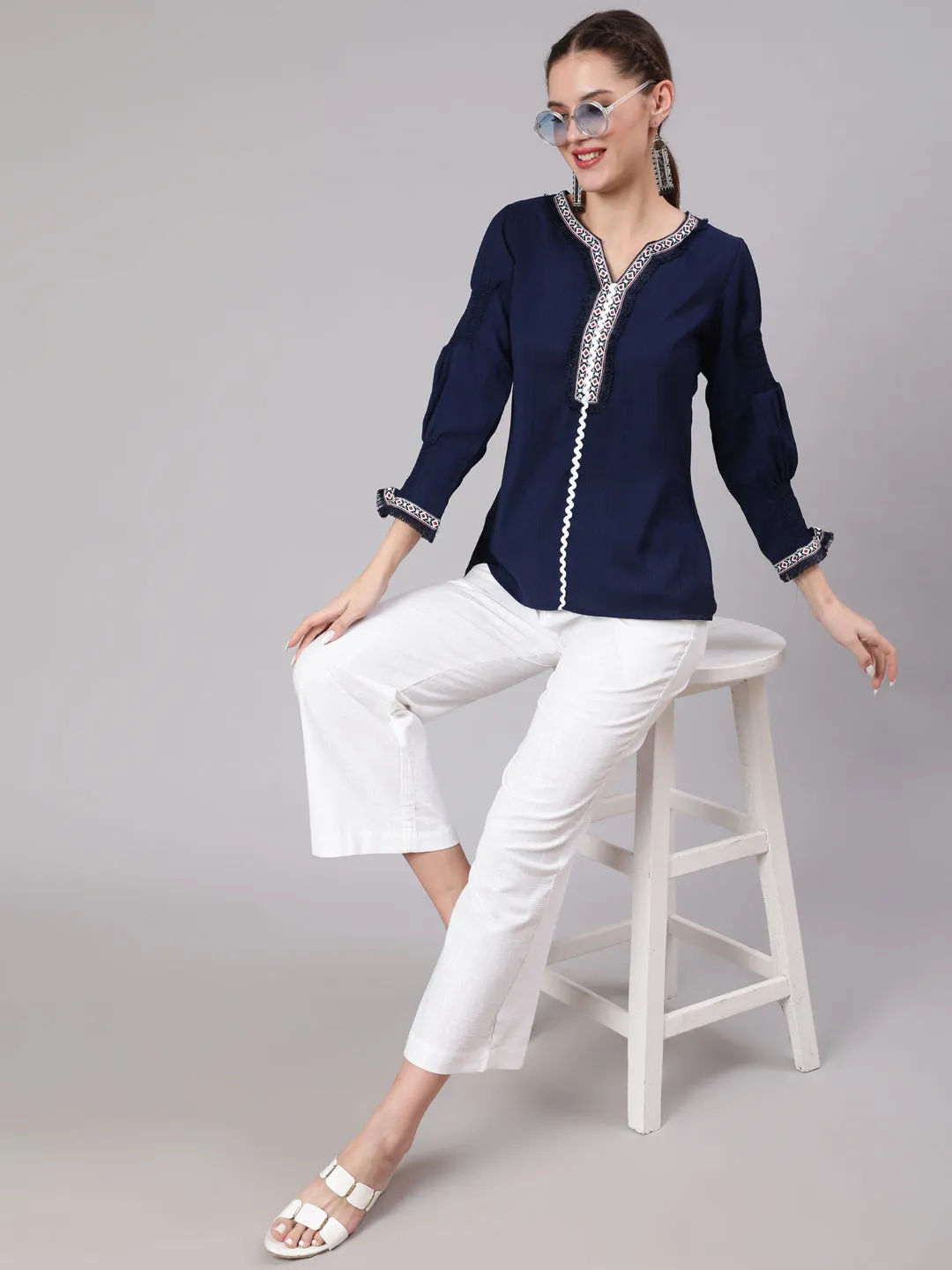 A Blue Poly Silk Lace Embellished Top With Smocked Sleeves With Wide-Leg White Pants